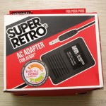 eStarland: Adaptador AC (Fonte de Alimentação) para Atari 2600 Fonte de Alimentação para Atari 2600 da Retro-bit, em sua embalagem