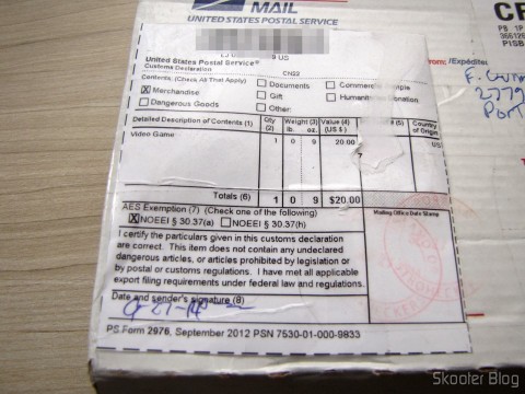 Caixa com o Harmony Cartridge - O cartucho com memória flash para o Atari 2600, após remoção da etiqueta dos Correios para revelar o valor declarado