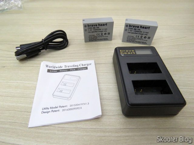2 Baterias NB-10L para câmera Canon, Carregador USB com LCD, cabo USB e manual.