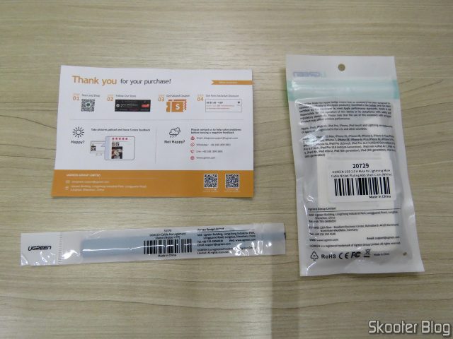 Cabo USB MFi para iPhone Ugreen Carga Rápida 2.4A e Dados, em sua embalagem, com folheto e brinde da Ugreen.