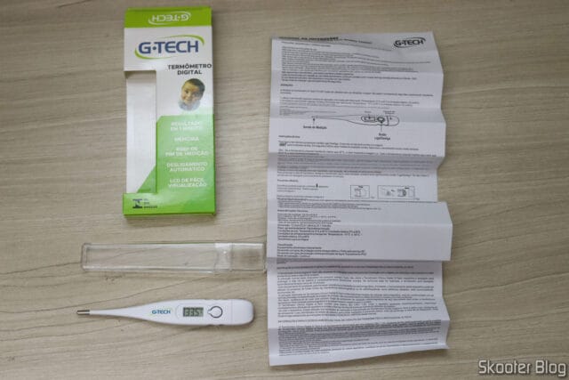 Termômetro Digital Clínico Branco G-Tech TH1027, com embalagem, estojo acrílico e manual de instruções.
